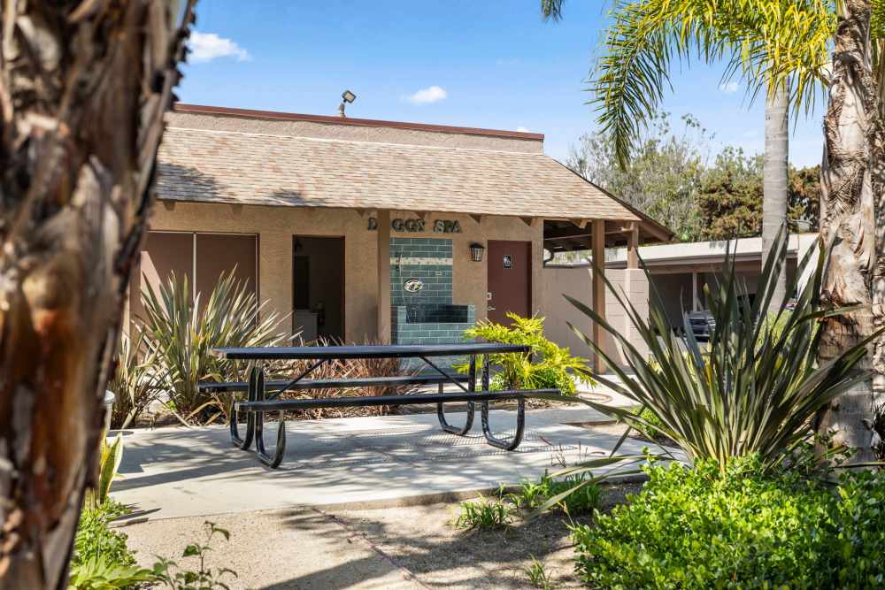 Outdoor seating at Bay Breeze Apartments in Costa Mesa, California