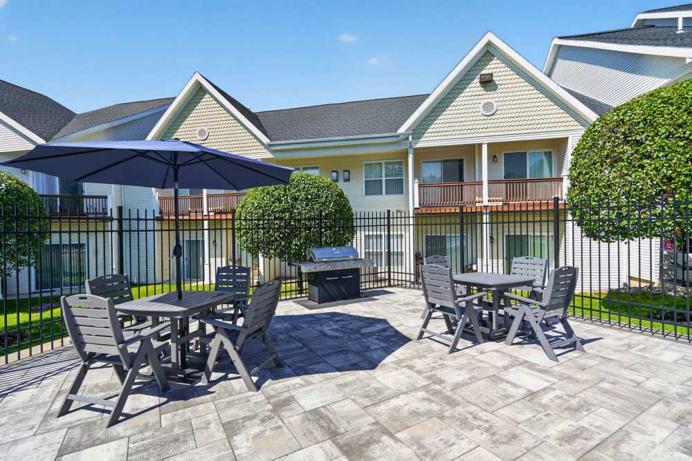 Community exterior view with well-maintained lawn at Mansions at Delmar, an Eagle Rock Community in Delmar, New York