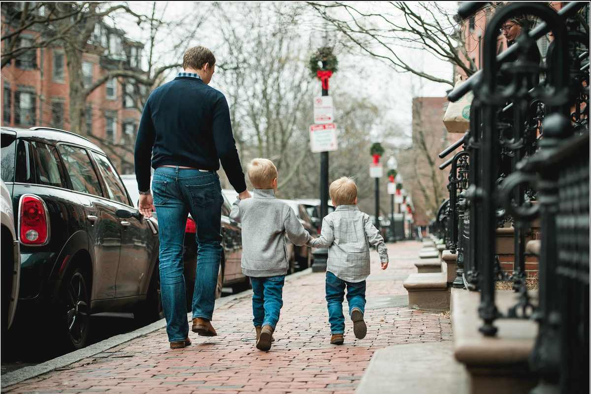 Resident with his kids at a neighborhood near Tenants Development Corporation III, LP in Boston, Massachusetts