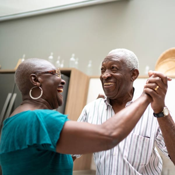 A resident couple dancing at Pacifica Senior Living Sterling in Sterling, Virginia.