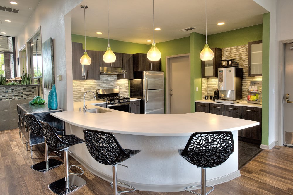 At Clubhouse kitchen with seating at Deer Valley Apartment Homes in Roseville, California