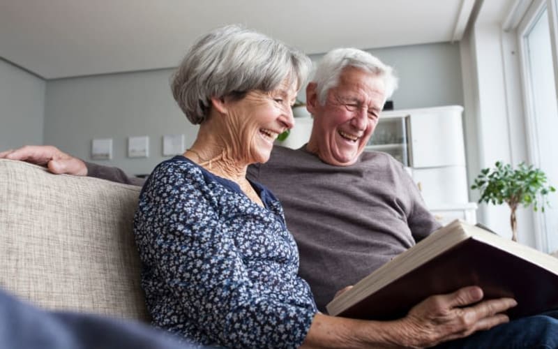 Couple reading at Grand Villa of Palm Coast in Palm Coast, Florida