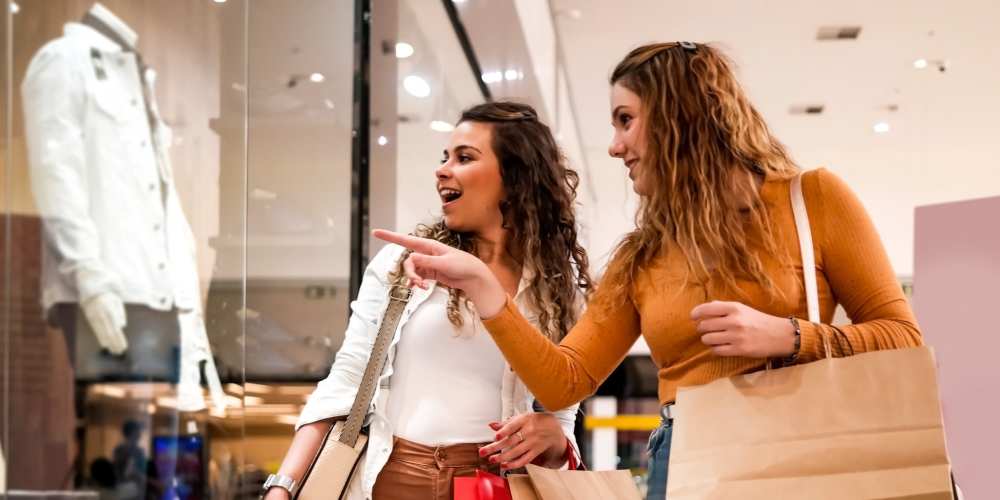 Resident friends shopping at mall near Grande Pointe in Orlando, Florida