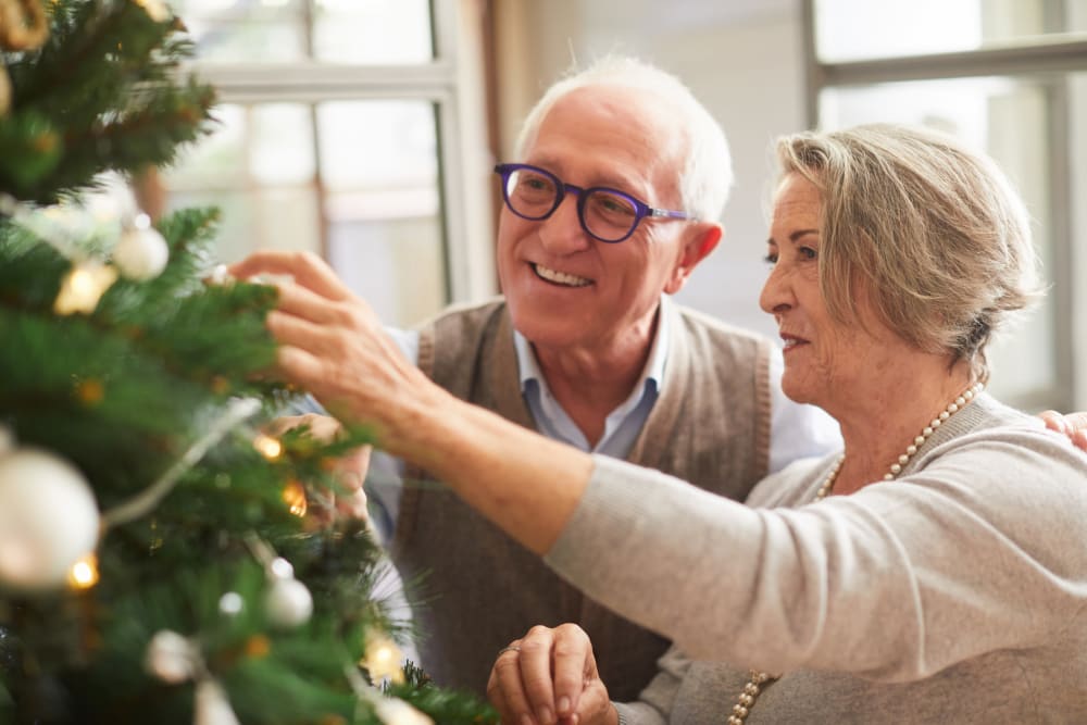 Residents decorating Christmas tree at Vista Prairie at Copperleaf in Willmar, Minnesota