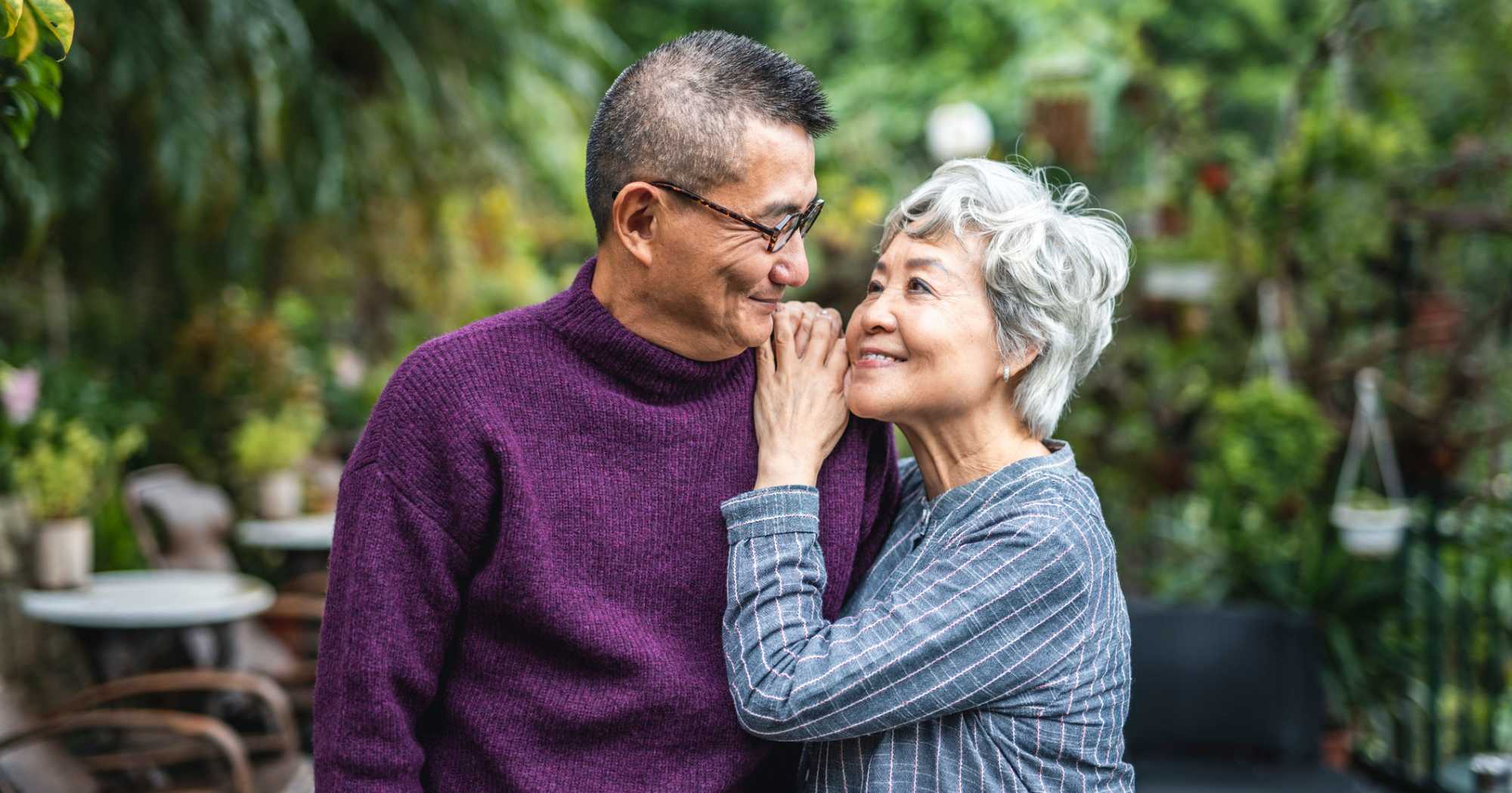 Two residents embracing at Clearwater at The Heights in Houston, Texas