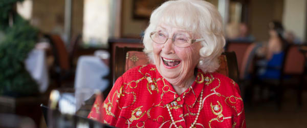Resident smiling and laughing at Lake Forest at Swift Creek in Midlothian, Virginia