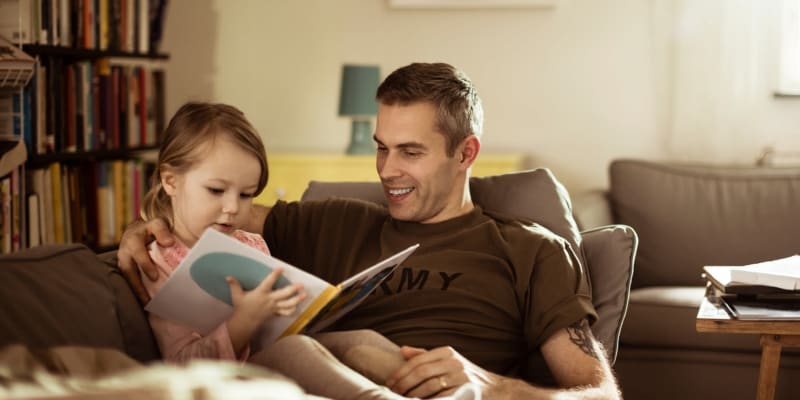 Father reading to daughter at Marine Palms in Twentynine Palms, California