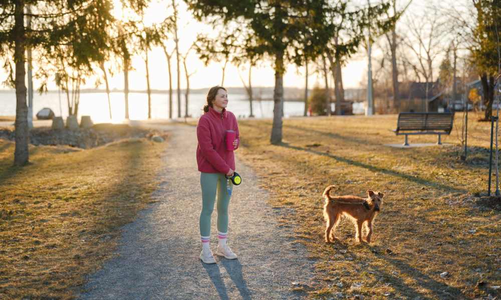 Resident with her dog in nearby park at Truckee River Terrace in Reno, Nevada