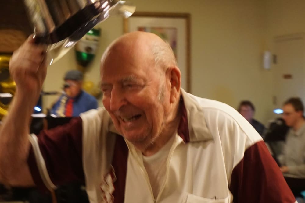 Resident tipping his hat at a New Year's Eve party at Winding Commons Senior Living in Carmichael, California