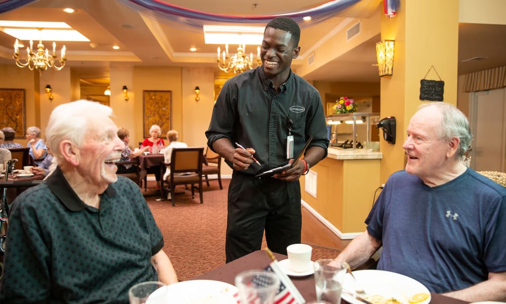 A resident from Touchmark at All Saints in Sioux Falls, South Dakota enjoying a meal