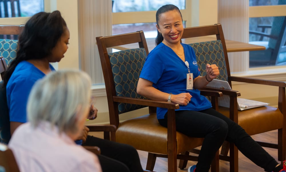 A resident exercising with team members at Touchmark on West Prospect in Appleton, Wisconsin