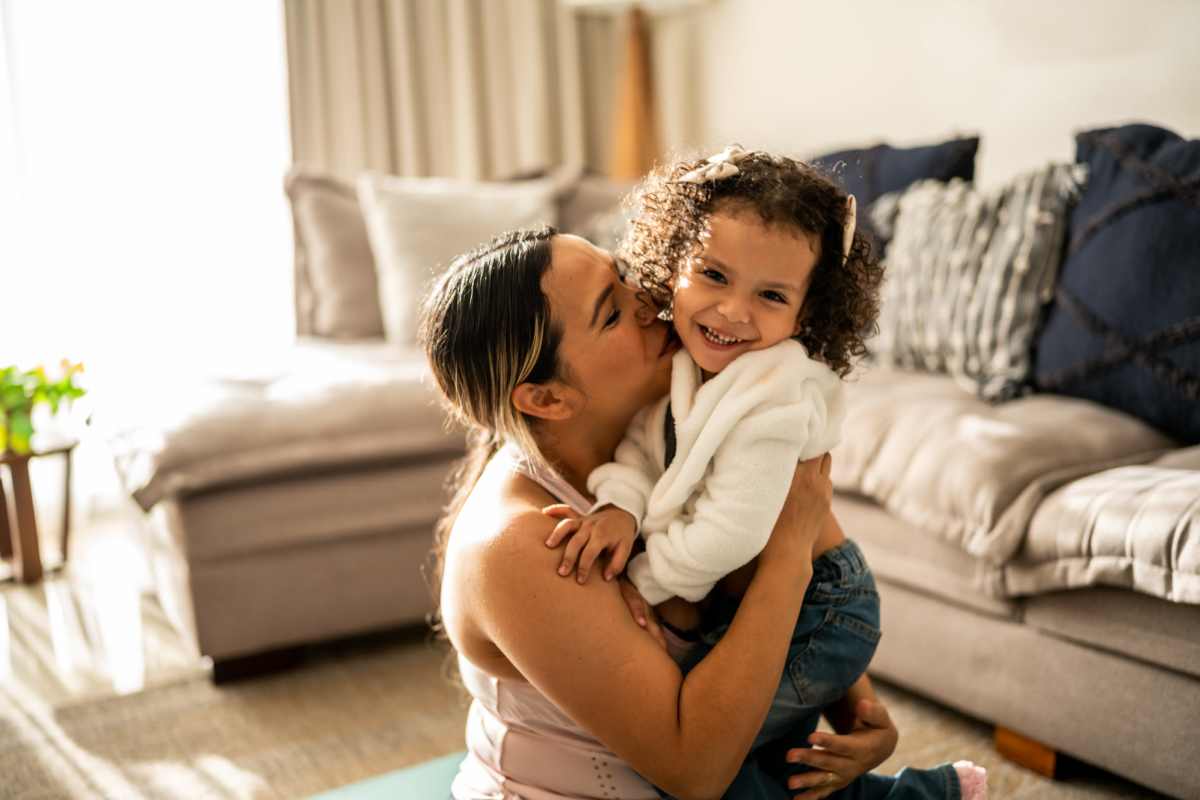 Resident hugging a young girl at Wallace Court Apartments in Waynesboro, Pennsylvania           