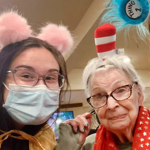 Resident and team member dressed up at Oxford Senior Living in Wichita, Kansas