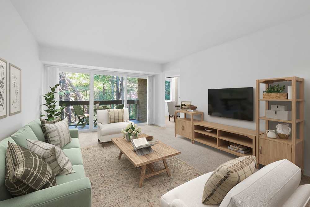 Spacious, well-lit living room with balcony at Fairway Apartments in Reston, Virginia