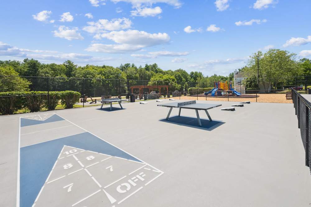 Shuffleboard and amenity court at Bay Ridge at Nashua Apartments in Nashua, New Hampshire