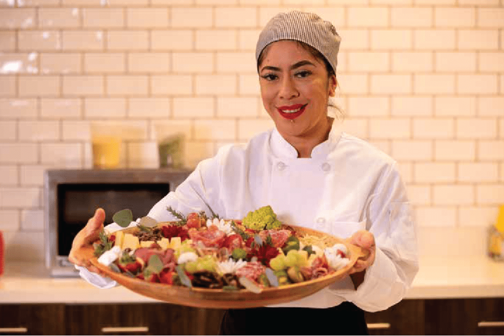 Chef presenting a platter of fresh fruits at Clearwater Beaverton in Beaverton, Oregon