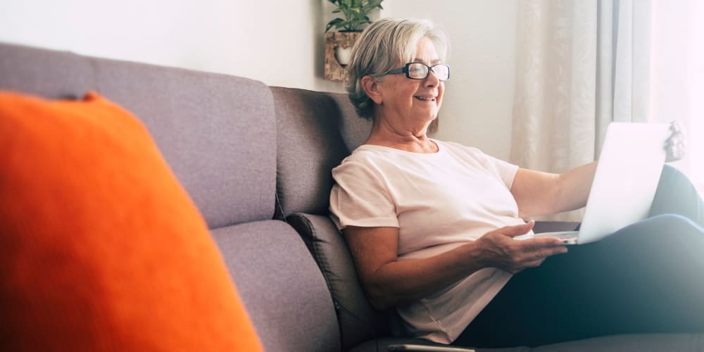 resident playing video game at Vista Prairie Communities in Champlin, Minnesota