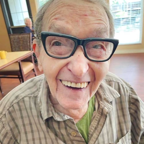 A happy resident of Oxford Glen Memory Care at Sachse in Sachse, Texas