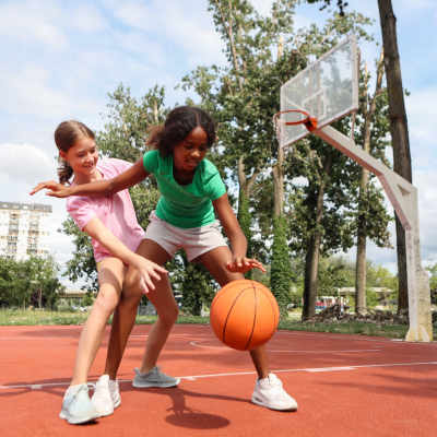Kids playing in the basketball court at Whispering Creek Villas, San Antonio, Texas