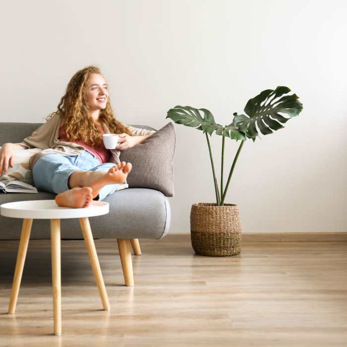 A resident sits on her sofa in her apartment at Messenger Place, Manassas, Virginia