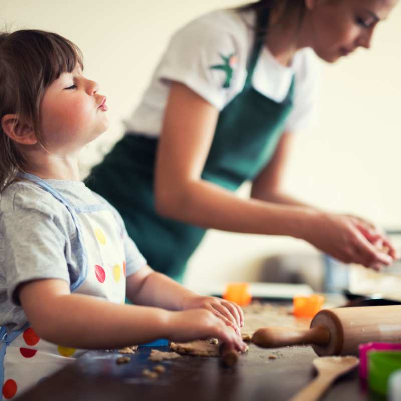 Mother and daughter bake cookies in their kitchen at Mason Avenue, Alexandria, Virginia