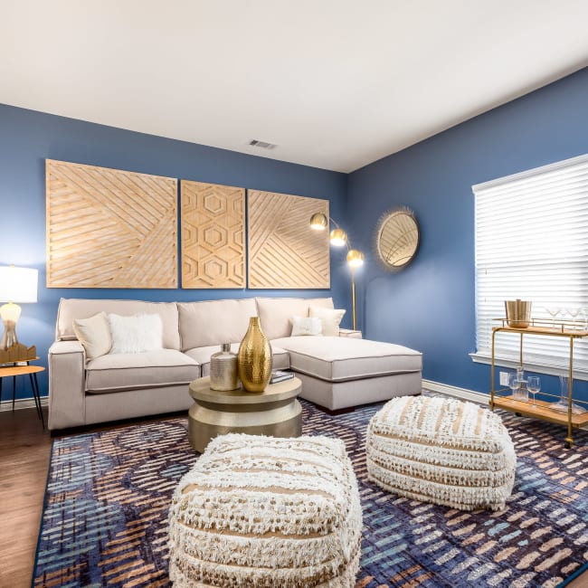 Well-decorated living room in model home at 4 Corners Apartments in Frisco, Texas