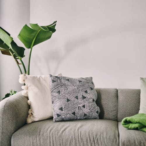 A sofa in a furnished living room at Union SLU in Seattle, Washington