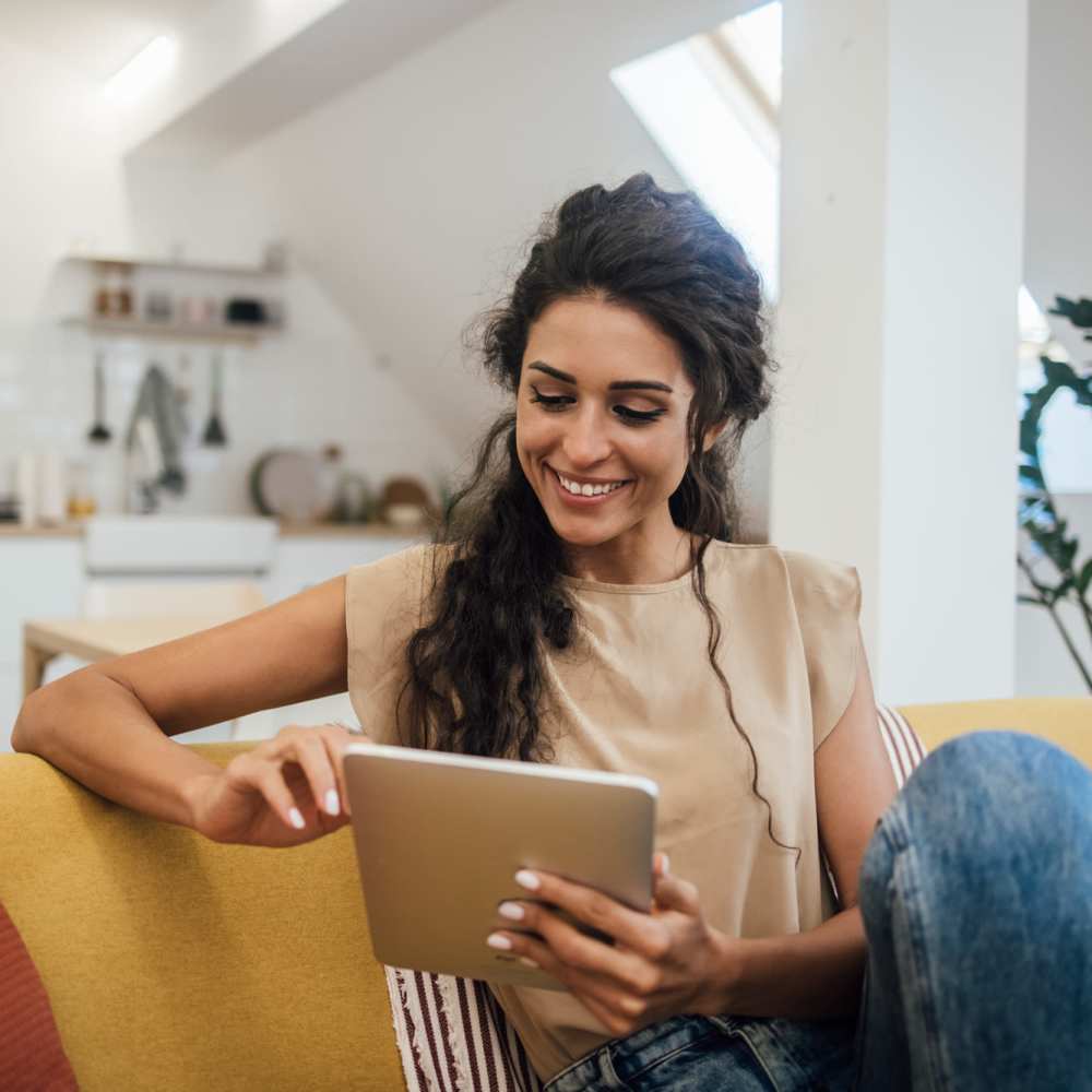 Resident looking in tab at Casa Bella in Victorville, California