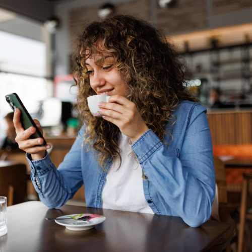 Woman sipping coffee near Linden in Portland, Oregon