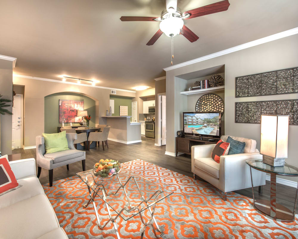 Large open-concept living area in a model home at Olympus 7th Street Station in Fort Worth, Texas