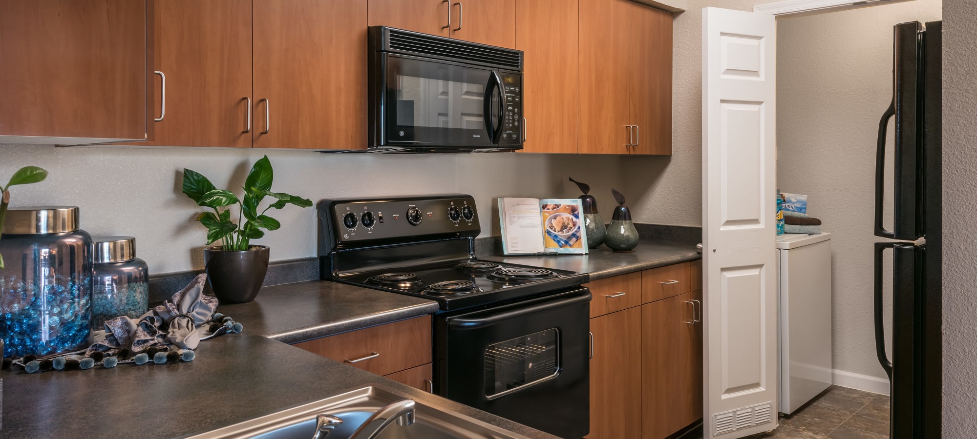 Inviting kitchen with laundry room at Azul at Spectrum in Gilbert, Arizona