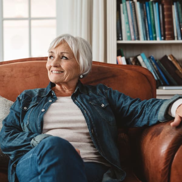 A resident relaxing in her chair at Chesapeake Place Senior Living in Chesapeake, Virginia.