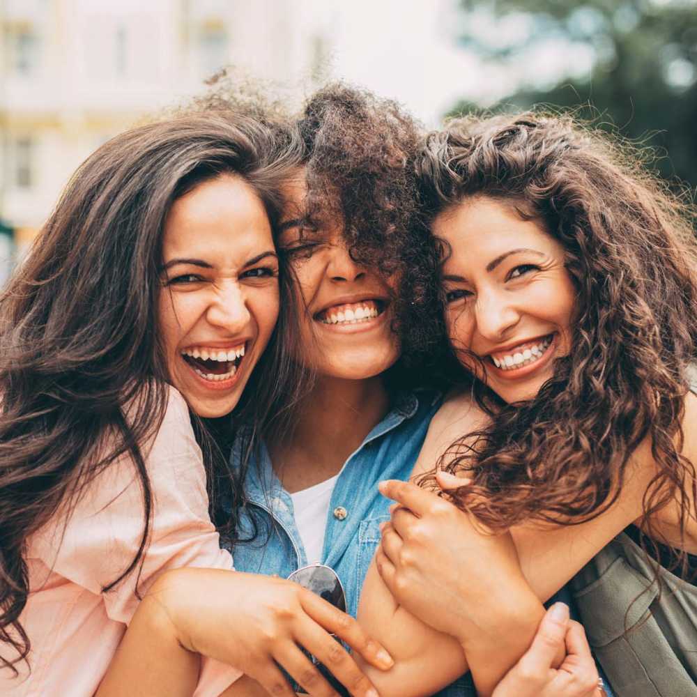 Three happy women having a good time near The Ariel in Charlotte,North Carolina