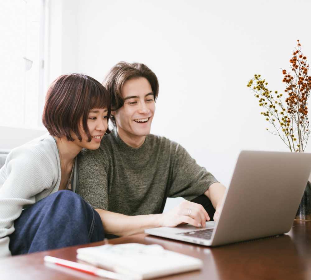 Couple working together at Breckinridge Point Apartments in Richardson, Texas
