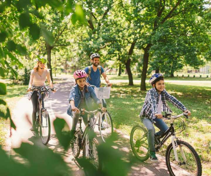 Residents riding bicycle at Signal Hill Apartments in Mechanicsville, Virginia