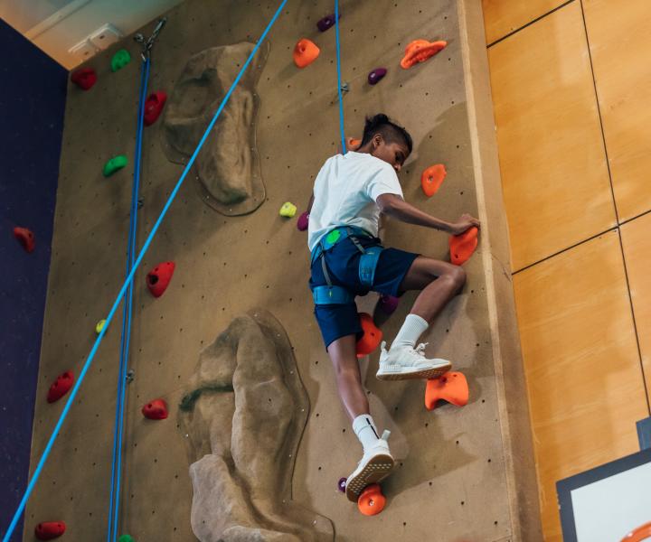 Resident doing activity in play zone nearWoodland Apartments San Antonio in San Antonio, Texas
