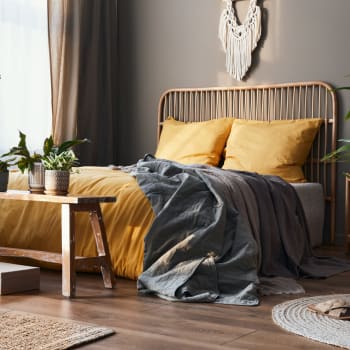 A furnished bedroom with a potted plant at Cypress Creek at Fayridge in Houston, Texas