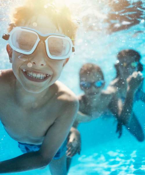 Kids enjoying in swimming pool at The Waters at Freeport in Freeport,Florida