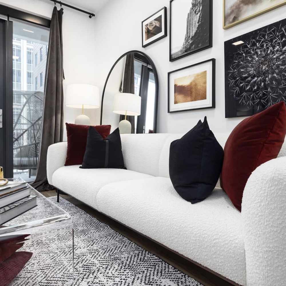 Apartments living room sofa with colorfull pillows at Novel Midtown in Atlanta, Georgia