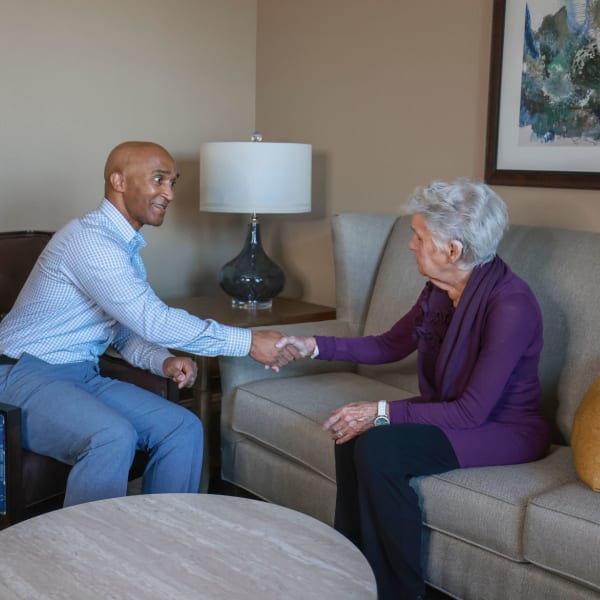 Residents enjoying a conversation over coffee at The Princeton Senior Living in Lee's Summit, Missouri