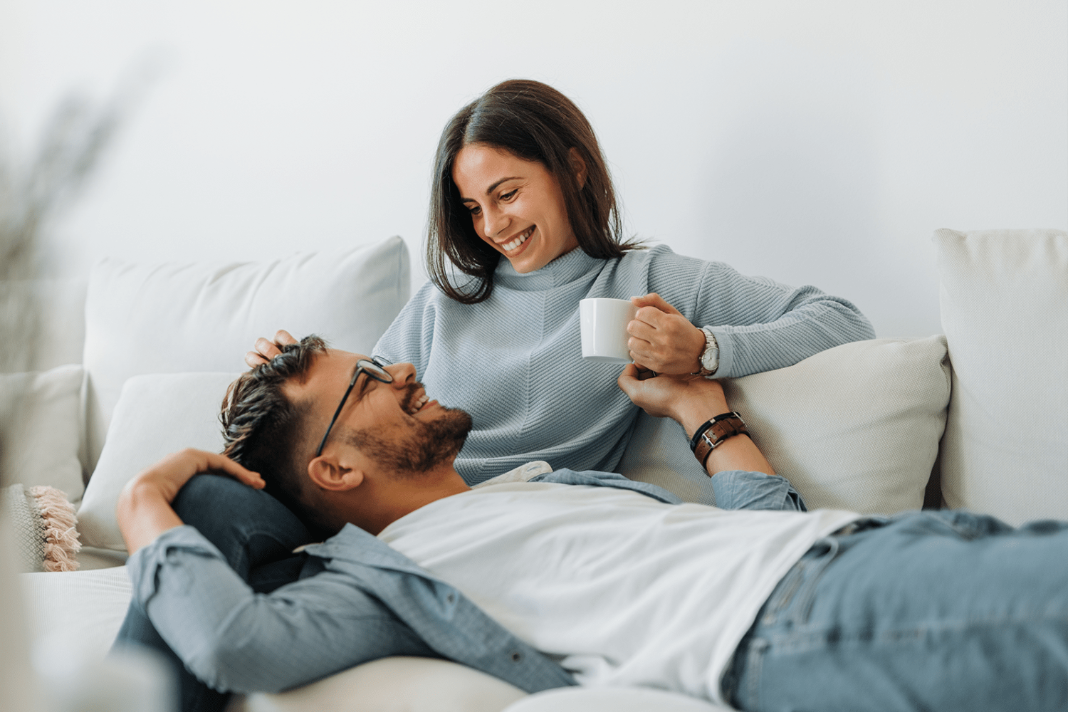 Couple relaxing in their new home at Vantage Pointe West Apartment Homes in Cincinnati, Ohio