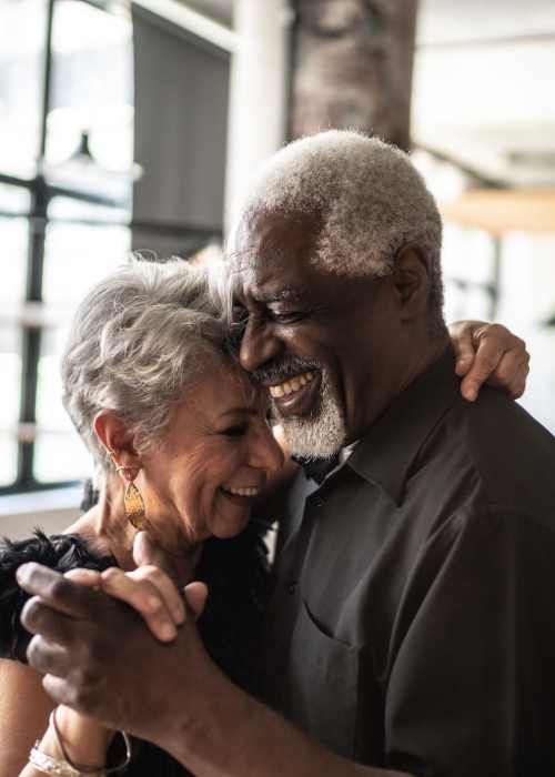 A happy resident dancing at Grand Villa of Ocala in Ocala, Florida