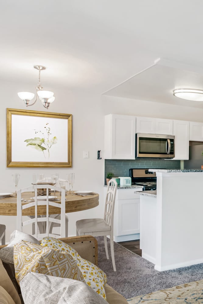 Dining area in a model home at Hill Brook Place Apartments in Bensalem, Pennsylvania