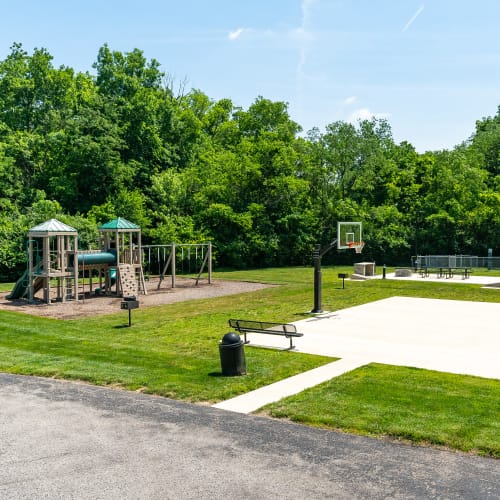Playground and sand volleyball court at Lakeside Landing Apartments in Lakeside Park, Kentucky