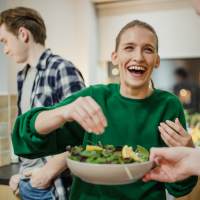 Resident friends had fun in the apartment kitchen at Carrington Park in Little Rock, Arkansas