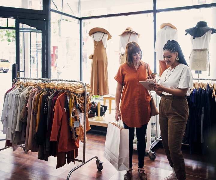 Resident shopping at a clothing boutique near The Rosewood Apartments in Vancouver, Washington