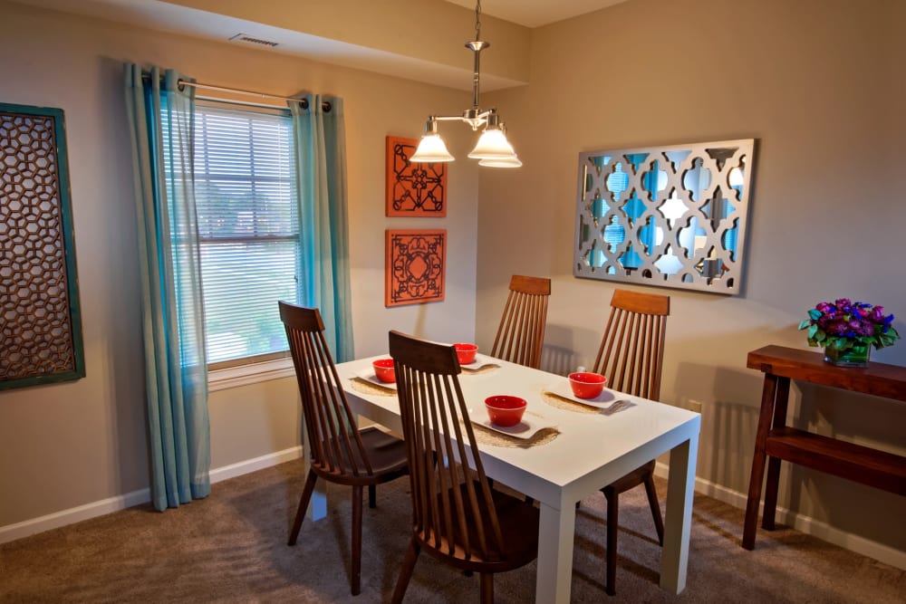 Dining area with vinyl plank flooring at Rochester Village Apartments at Park Place in Cranberry Township, Pennsylvania