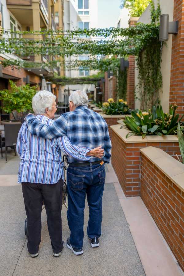 Resident couple on a walk together near Merrill Gardens at Rockridge in Oakland, California
