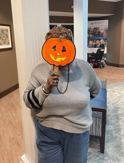 Waterview Court residents loved posing for photos with a fun pumpkin mask!