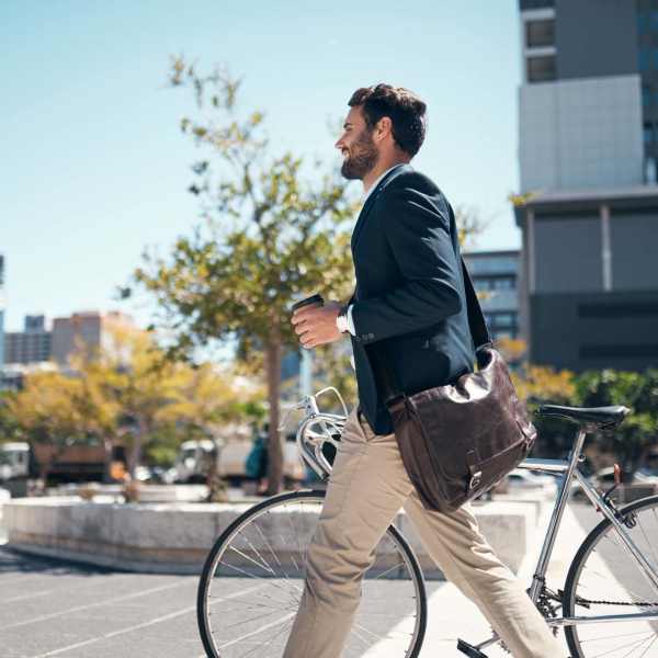 Man walking with his bike near Ascent Residential in Montgomery, Alabama